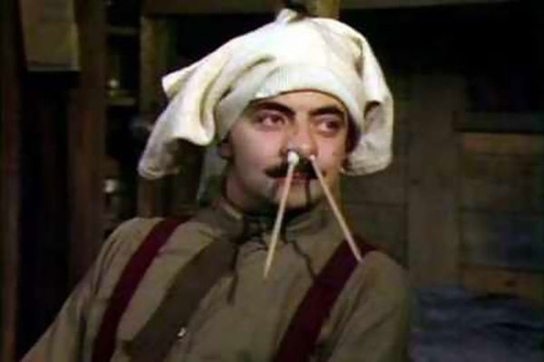 Blackadder with pencils up his nose